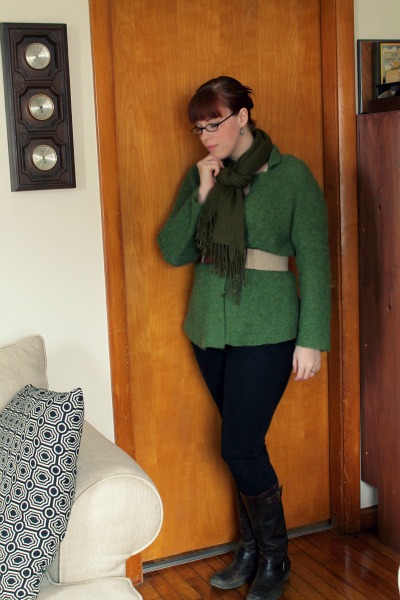 green sweater belted with scarf